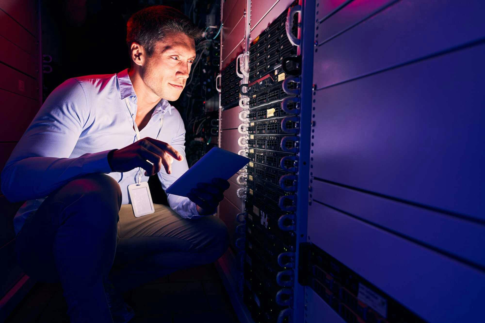 guy carefully looking for flaws in data center
